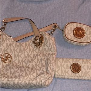Michael Kors Purse, mini Makeup Bag, and Wallet.